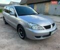 Серый Мицубиси Лансер, объемом двигателя 1.6 л и пробегом 310 тыс. км за 3900 $, фото 1 на Automoto.ua