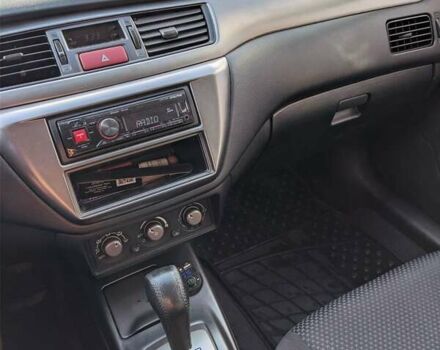 Сірий Міцубісі Lancer, об'ємом двигуна 1.58 л та пробігом 220 тис. км за 4499 $, фото 29 на Automoto.ua