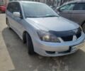 Сірий Міцубісі Lancer, об'ємом двигуна 2 л та пробігом 297 тис. км за 4400 $, фото 1 на Automoto.ua