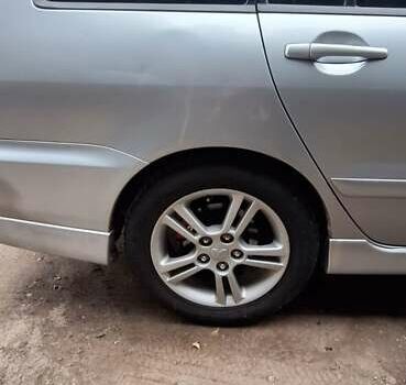 Серый Мицубиси Лансер, объемом двигателя 1.58 л и пробегом 223 тыс. км за 3200 $, фото 2 на Automoto.ua