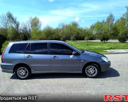 Серый Мицубиси Лансер, объемом двигателя 1.6 л и пробегом 305 тыс. км за 3300 $, фото 1 на Automoto.ua