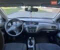 Серый Мицубиси Лансер, объемом двигателя 1.58 л и пробегом 276 тыс. км за 3700 $, фото 6 на Automoto.ua