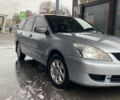 Сірий Міцубісі Lancer, об'ємом двигуна 1.58 л та пробігом 247 тис. км за 4350 $, фото 4 на Automoto.ua