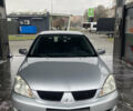 Сірий Міцубісі Lancer, об'ємом двигуна 1.58 л та пробігом 247 тис. км за 4350 $, фото 3 на Automoto.ua