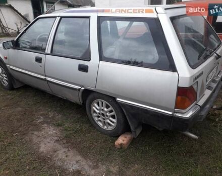 Сірий Міцубісі Lancer, об'ємом двигуна 1.5 л та пробігом 254 тис. км за 1100 $, фото 1 на Automoto.ua