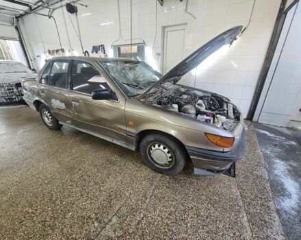 Сірий Міцубісі Lancer, об'ємом двигуна 1.5 л та пробігом 189 тис. км за 577 $, фото 1 на Automoto.ua