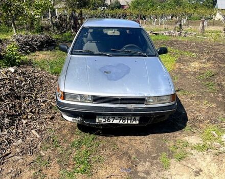 Серый Мицубиси Лансер, объемом двигателя 1.5 л и пробегом 510 тыс. км за 900 $, фото 1 на Automoto.ua