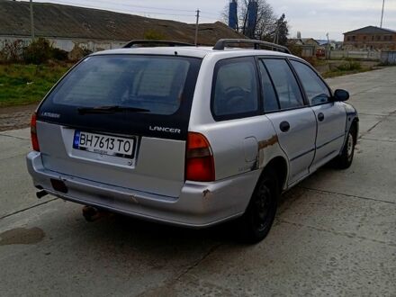 Мицубиси Лансер 1993 в Подольск (Котовск) на Automoto.ua Серый Мицубиси Лансер, объемом двигателя 2 л и пробегом 111 тыс. км за 1200 $, фото 1 на Automoto.ua