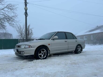 Серый Мицубиси Лансер, объемом двигателя 1.6 л и пробегом 300 тыс. км за 2100 $, фото 1 на Automoto.ua