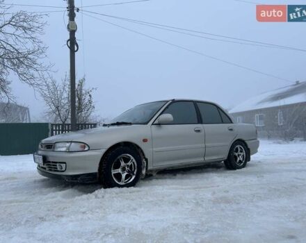 Серый Мицубиси Лансер, объемом двигателя 1.6 л и пробегом 300 тыс. км за 2100 $, фото 1 на Automoto.ua
