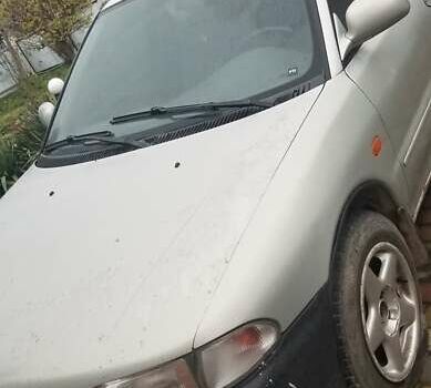 Серый Мицубиси Лансер, объемом двигателя 1.3 л и пробегом 377 тыс. км за 1000 $, фото 1 на Automoto.ua