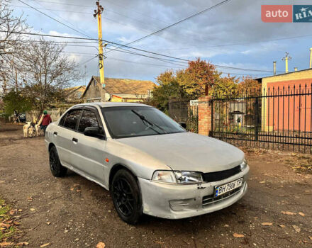 Сірий Міцубісі Lancer, об'ємом двигуна 1.3 л та пробігом 302 тис. км за 950 $, фото 1 на Automoto.ua