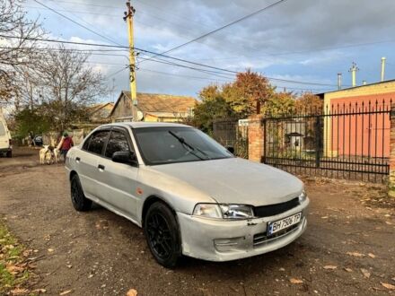 Серый Мицубиси Лансер, объемом двигателя 1.3 л и пробегом 300 тыс. км за 1000 $, фото 1 на Automoto.ua