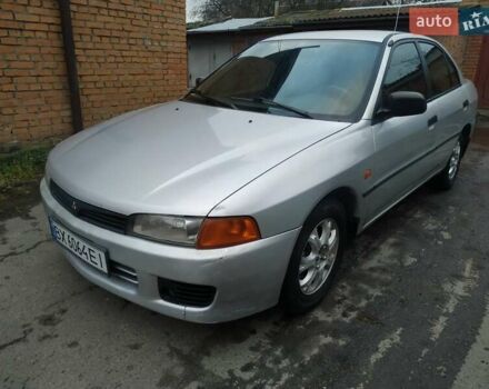 Серый Мицубиси Лансер, объемом двигателя 1.3 л и пробегом 367 тыс. км за 1050 $, фото 1 на Automoto.ua