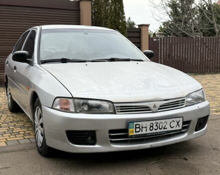 Серый Мицубиси Лансер, объемом двигателя 1.3 л и пробегом 320 тыс. км за 1450 $, фото 1 на Automoto.ua