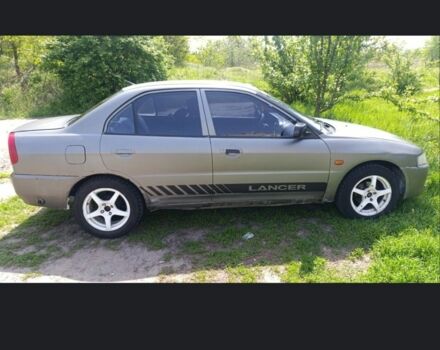 Сірий Міцубісі Lancer, об'ємом двигуна 1.3 л та пробігом 450 тис. км за 1000 $, фото 1 на Automoto.ua