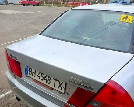 Серый Мицубиси Лансер, объемом двигателя 1.3 л и пробегом 360 тыс. км за 1750 $, фото 1 на Automoto.ua