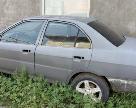 Серый Мицубиси Лансер, объемом двигателя 1.3 л и пробегом 200 тыс. км за 520 $, фото 1 на Automoto.ua