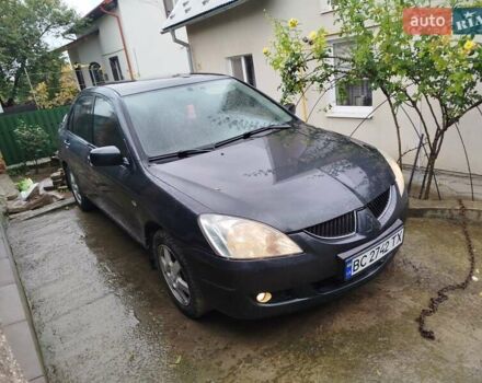 Серый Мицубиси Лансер, объемом двигателя 1.6 л и пробегом 260 тыс. км за 2750 $, фото 1 на Automoto.ua