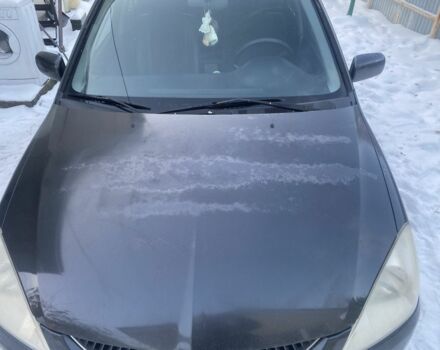 Серый Мицубиси Лансер, объемом двигателя 1 л и пробегом 330 тыс. км за 2913 $, фото 1 на Automoto.ua