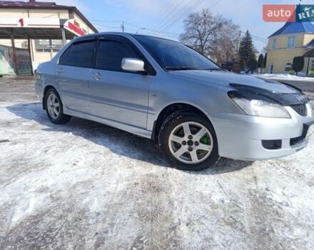Сірий Міцубісі Lancer, об'ємом двигуна 1.58 л та пробігом 240 тис. км за 3800 $, фото 1 на Automoto.ua