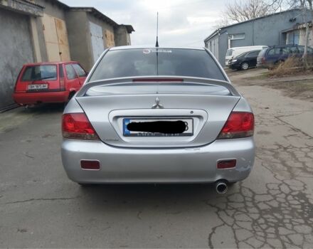 Серый Мицубиси Лансер, объемом двигателя 1.6 л и пробегом 260 тыс. км за 3200 $, фото 1 на Automoto.ua