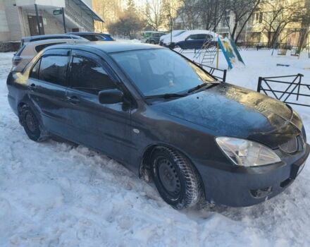 Серый Мицубиси Лансер, объемом двигателя 1.6 л и пробегом 273 тыс. км за 2900 $, фото 1 на Automoto.ua