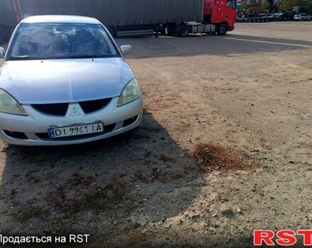 Серый Мицубиси Лансер, объемом двигателя 1.6 л и пробегом 318 тыс. км за 3000 $, фото 1 на Automoto.ua