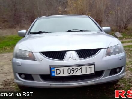 Серый Мицубиси Лансер, объемом двигателя 2 л и пробегом 352 тыс. км за 3950 $, фото 1 на Automoto.ua