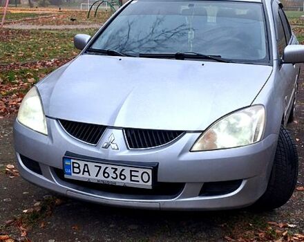 Серый Мицубиси Лансер, объемом двигателя 1.6 л и пробегом 213 тыс. км за 4400 $, фото 1 на Automoto.ua