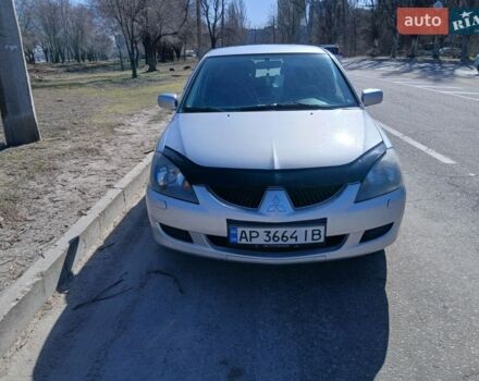 Серый Мицубиси Лансер, объемом двигателя 1.6 л и пробегом 291 тыс. км за 3700 $, фото 1 на Automoto.ua