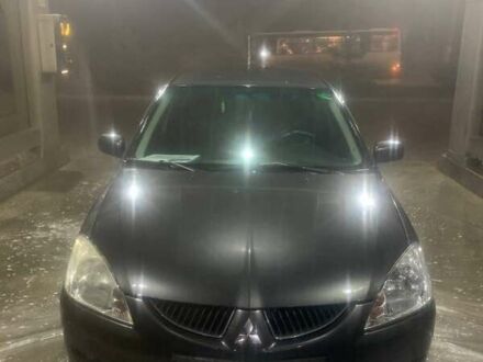 Сірий Міцубісі Lancer, об'ємом двигуна 1.6 л та пробігом 324 тис. км за 4200 $, фото 1 на Automoto.ua