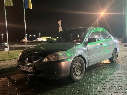 Серый Мицубиси Лансер, объемом двигателя 1.6 л и пробегом 269 тыс. км за 2999 $, фото 1 на Automoto.ua