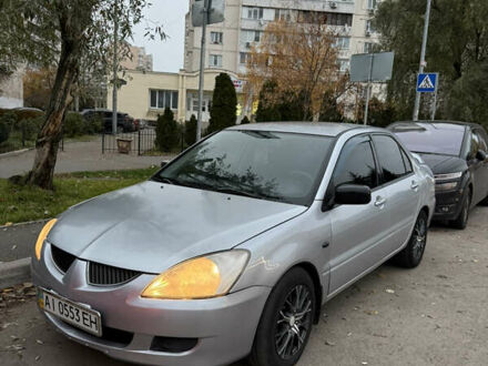 Серый Мицубиси Лансер, объемом двигателя 1.58 л и пробегом 299 тыс. км за 3850 $, фото 1 на Automoto.ua