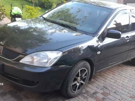 Сірий Міцубісі Lancer, об'ємом двигуна 1.58 л та пробігом 238 тис. км за 3000 $, фото 1 на Automoto.ua