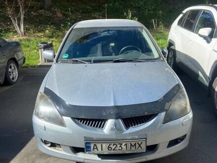 Сірий Міцубісі Lancer, об'ємом двигуна 1.58 л та пробігом 210 тис. км за 3500 $, фото 1 на Automoto.ua