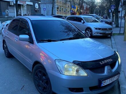 Сірий Міцубісі Lancer, об'ємом двигуна 1.6 л та пробігом 380 тис. км за 4600 $, фото 1 на Automoto.ua