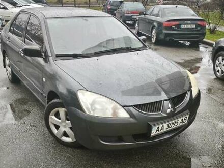 Сірий Міцубісі Lancer, об'ємом двигуна 1.58 л та пробігом 110 тис. км за 2999 $, фото 1 на Automoto.ua