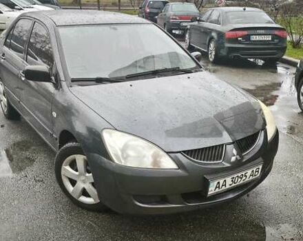 Сірий Міцубісі Lancer, об'ємом двигуна 1.58 л та пробігом 110 тис. км за 2999 $, фото 1 на Automoto.ua