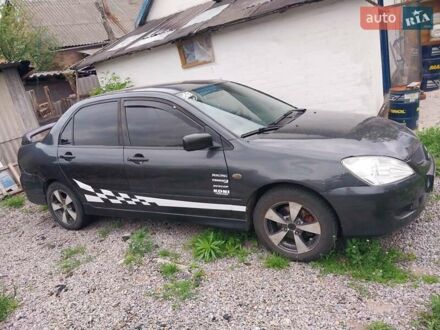 Мицубиси Лансер 2004 в Белой Церкве на Automoto.ua Серый Мицубиси Лансер, объемом двигателя 1.58 л и пробегом 336 тыс. км за 3500 $, фото 1 на Automoto.ua