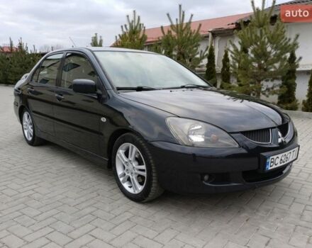 Серый Мицубиси Лансер, объемом двигателя 2 л и пробегом 299 тыс. км за 4650 $, фото 1 на Automoto.ua