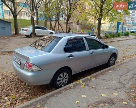 Серый Мицубиси Лансер, объемом двигателя 1.3 л и пробегом 230 тыс. км за 3900 $, фото 1 на Automoto.ua