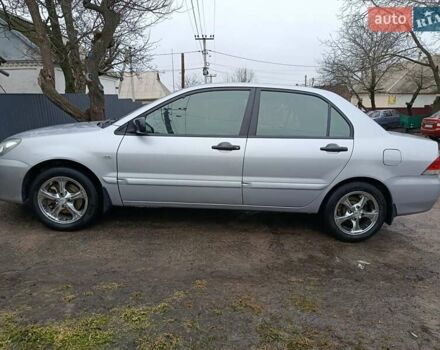 Серый Мицубиси Лансер, объемом двигателя 1.58 л и пробегом 280 тыс. км за 4000 $, фото 1 на Automoto.ua