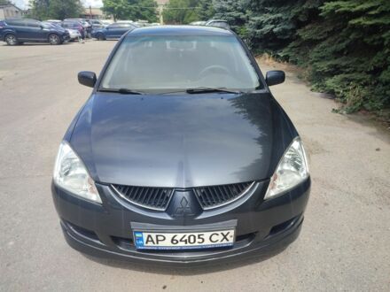 Мицубиси Лансер 2004 в Запорожье на Automoto.ua Серый Мицубиси Лансер, объемом двигателя 1.6 л и пробегом 390 тыс. км за 4500 $, фото 1 на Automoto.ua