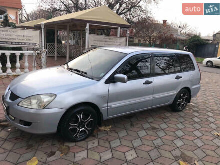 Серый Мицубиси Лансер, объемом двигателя 1.58 л и пробегом 240 тыс. км за 3500 $, фото 1 на Automoto.ua