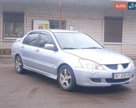 Серый Мицубиси Лансер, объемом двигателя 2 л и пробегом 300 тыс. км за 2850 $, фото 1 на Automoto.ua