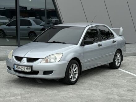 Серый Мицубиси Лансер, объемом двигателя 1.6 л и пробегом 360 тыс. км за 2400 $, фото 1 на Automoto.ua