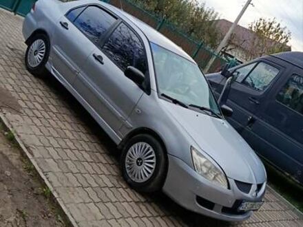 Серый Мицубиси Лансер, объемом двигателя 1.58 л и пробегом 441 тыс. км за 2650 $, фото 1 на Automoto.ua