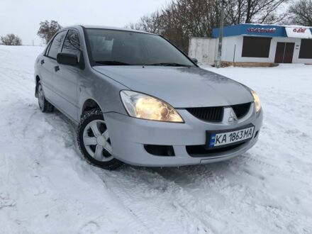 Сірий Міцубісі Lancer, об'ємом двигуна 0.13 л та пробігом 190 тис. км за 4250 $, фото 1 на Automoto.ua