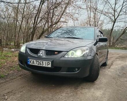 Серый Мицубиси Лансер, объемом двигателя 1.58 л и пробегом 360 тыс. км за 4000 $, фото 1 на Automoto.ua
